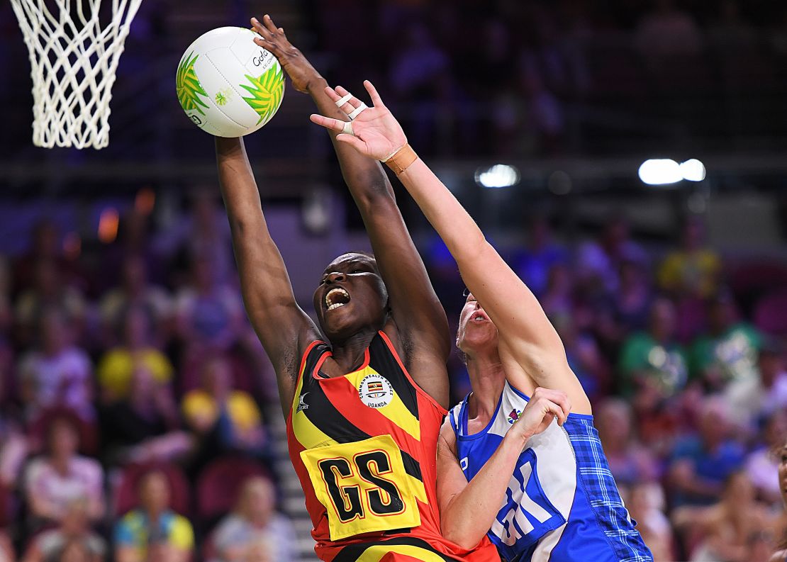 Ugandan captain Peace Proscovia drives toward the net against Scotland.