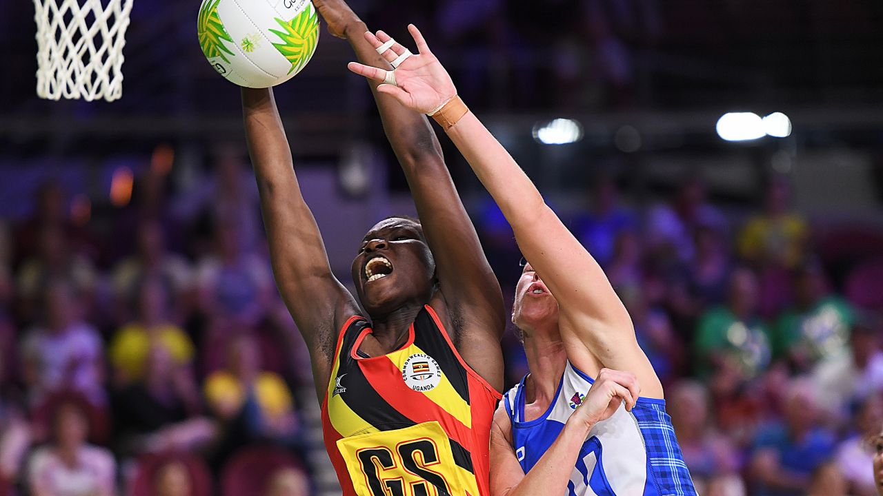 Ugandan captain Peace Proscovia drives toward the net against Scotland.