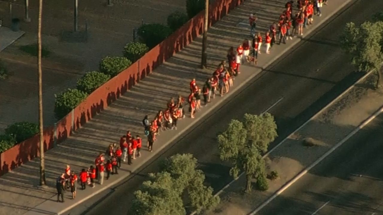Protesting teachers gather Wednesday before class outside Ironwood High School in Glendale, Arizona.