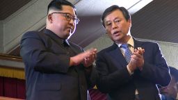 This picture captured from a video footage by Korea Pool reporters shows North Korean leader Kim Jong Un (L) and South Korea's Culture, Sports and Tourism Minister Do Jong-whan (R) during a rare concert by South Korean musicians at the 1,500-seat East Pyongyang Grand Theatre in Pyongyang on April 1, 2018.
North Korean leader Kim Jong Un on April 1 attended the first concert in Pyongyang for over a decade by South Korean entertainers, including a K-pop girlband, the latest gesture of reconciliation before a rare inter-Korean summit.  / AFP PHOTO / KOREA POOL / - / South Korea OUT        (Photo credit should read -/AFP/Getty Images)