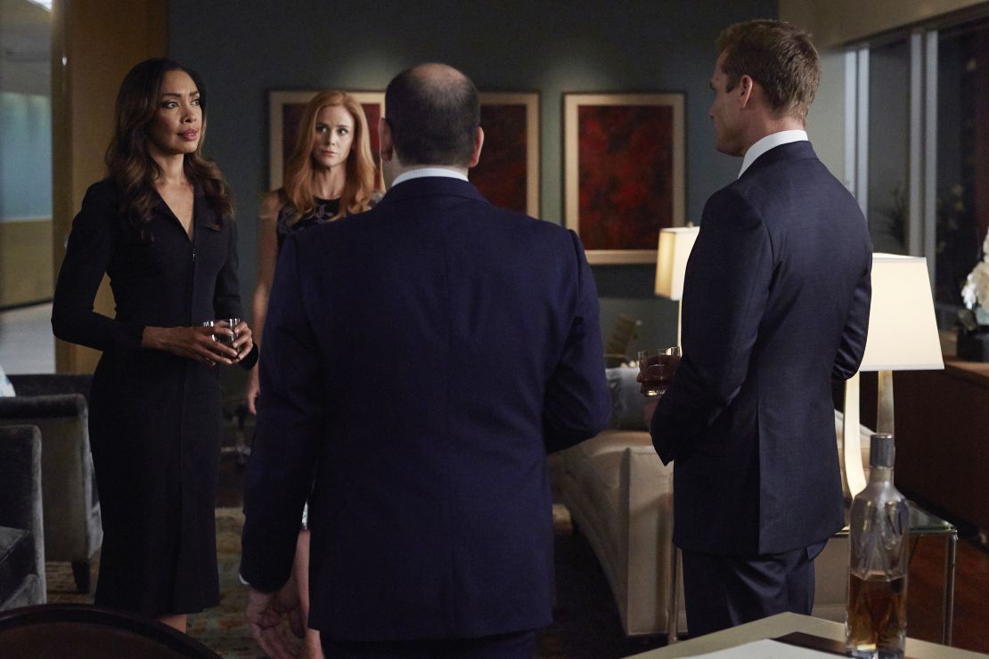 Gina Torres as Jessica Pearson, Sarah Rafferty as Donna Paulsen, and Gabriel Macht as Harvey Specter in "Suits."
