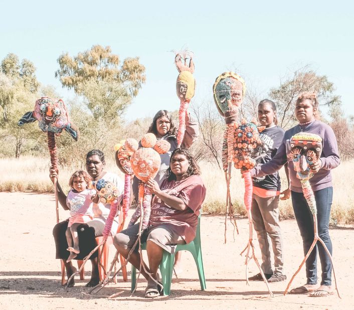 Members of Yarrenyty Arltere Artists with their soft sculptures in Larapinta Valley Town Camp in Australia's Northern Territory.