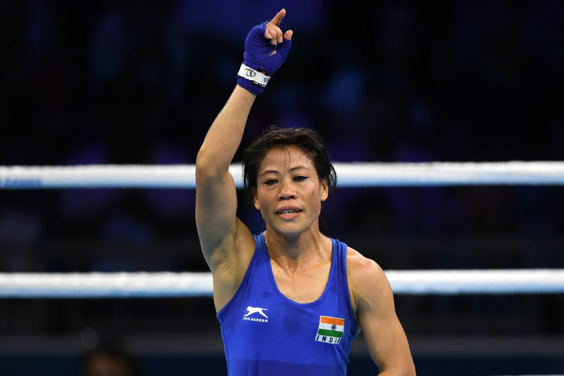 Kom celebrates after winning her semifinal boxing match during the Commonwealth Games.