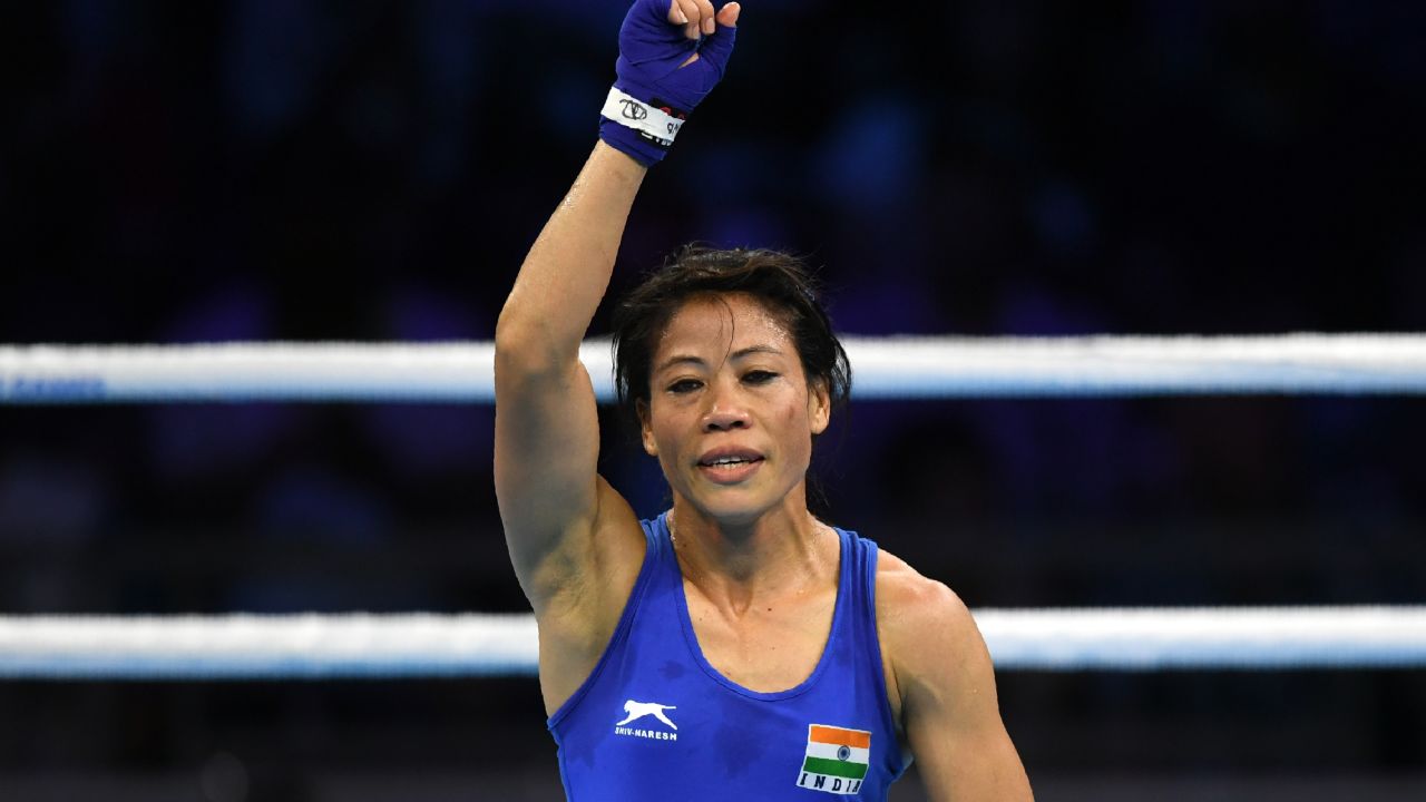 Kom celebrates after winning her semifinal boxing match during the Commonwealth Games.