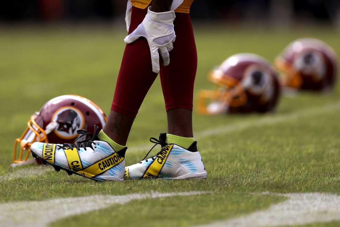 Wide receiver DeSean Jackson #11 of the Washington Redskins wears cleats displaying police caution tape prior to a game against the Cleveland Browns at FedExField on October 2, 2016 in Landover, Maryland.