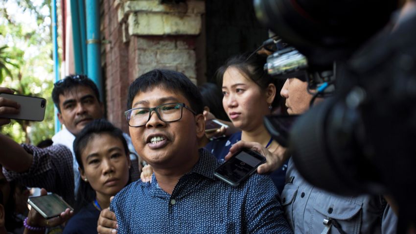 Detained Myanmar journalist Wa Lone (C) is escorted by police to a prison van after another day in his ongoing trial in Yangon on April 11, 2018.
A Myanmar court on April 11 rejected a motion to drop a case against two Reuters journalists arrested while investigating a massacre of Rohingya Muslims, pushing ahead with a controversial prosecution that has sparked global outrage. / AFP PHOTO / SAI AUNG MAIN        (Photo credit should read SAI AUNG MAIN/AFP/Getty Images)