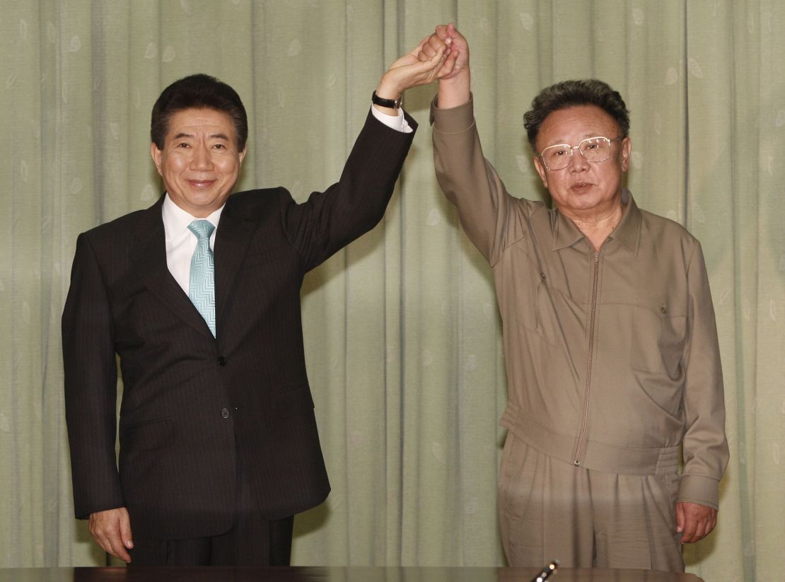 The late North Korean leader Kim Jong Il clasps hands with former South Korean President Roh Moo-hyun after they exchanged a joint statement on October 4, 2007 in Pyongyang, North Korea. Roh died in 2009.