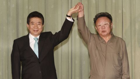 The late North Korean leader Kim Jong Il clasps hands with former South Korean President Roh Moo-hyun after they exchanged a joint statement on October 4, 2007 in Pyongyang, North Korea. Roh died in 2009.