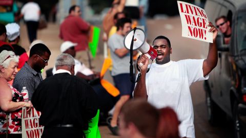 Antonio Cathey leads a crowd of fast food workers in a Fight for $15 protest in Memphis. The campaign has raised wages for low income workers but inspired a fierce counterattack by some lawmakers.