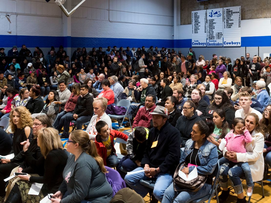 People packed the gym at Hillcrest Elementary School in Morristown, Tennessee, on Monday for a prayer vigil after nearly 100 people were detained in an immigration raid. 