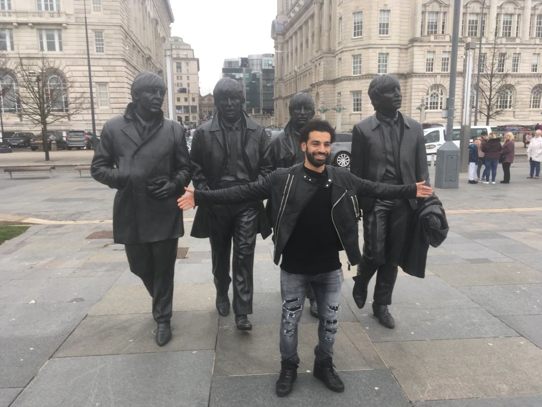 Salah lines up alongside the Beatles statue on Liverpool Waterfront.