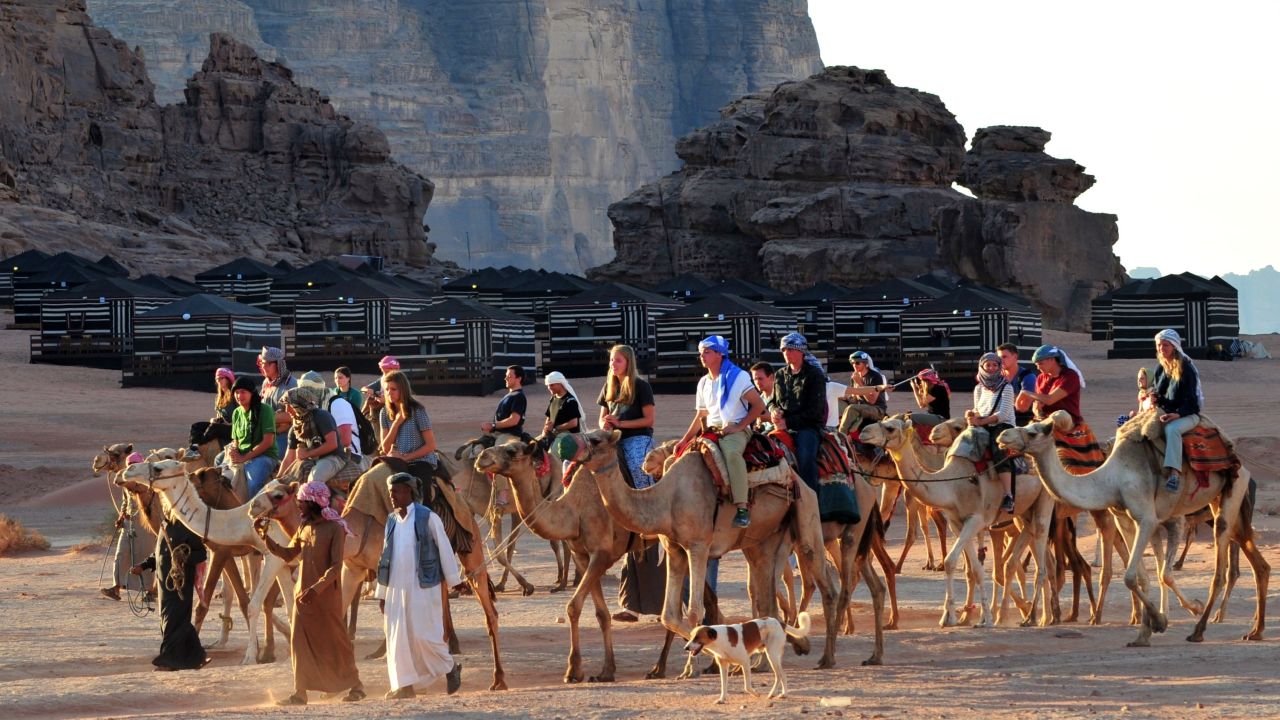 Local Bedouins take tourists on a camel ride through the Wadi Rum.