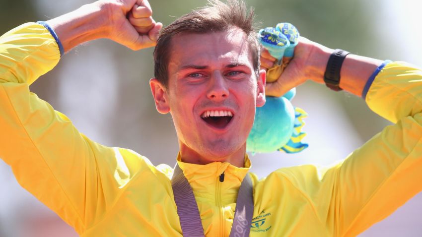 GOLD COAST, AUSTRALIA - APRIL 08:  Gold medalist Dane Bird-Smith of Australia celebrates on the podium during the medal ceremony for the Men?s 20km Race Walk Final on day four of the Gold Coast 2018 Commonwealth Games at Currumbin Beachfront on April 8, 2018 on the Gold Coast, Australia.  (Photo by Michael Dodge/Getty Images)