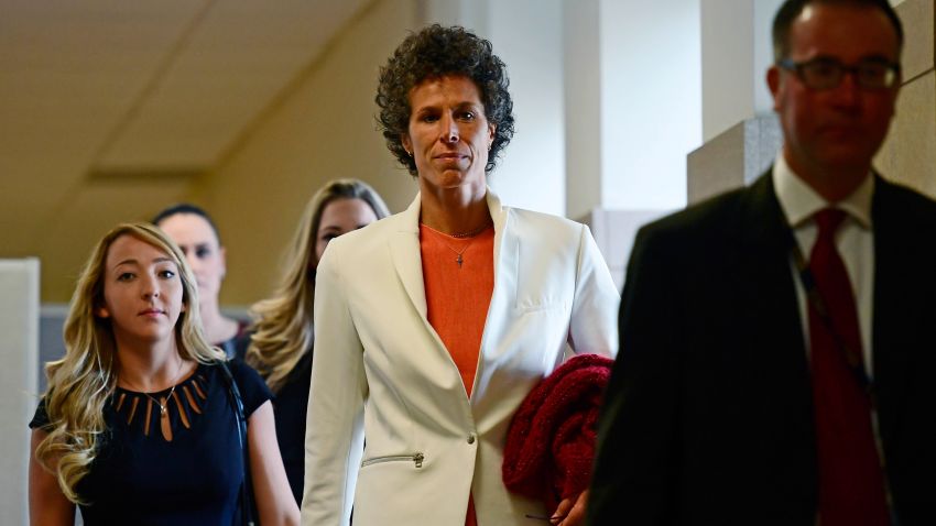 Andrea Constand, center, walks into a courtroom for Bill Cosby's sexual assault trial at the Montgomery County Courthouse, Friday, April 13, 2018, in Norristown, Pa.  Constand, Bill Cosby's chief accuser, will take the witness stand on Friday. (AP Photo/Corey Perrine, Pool)
