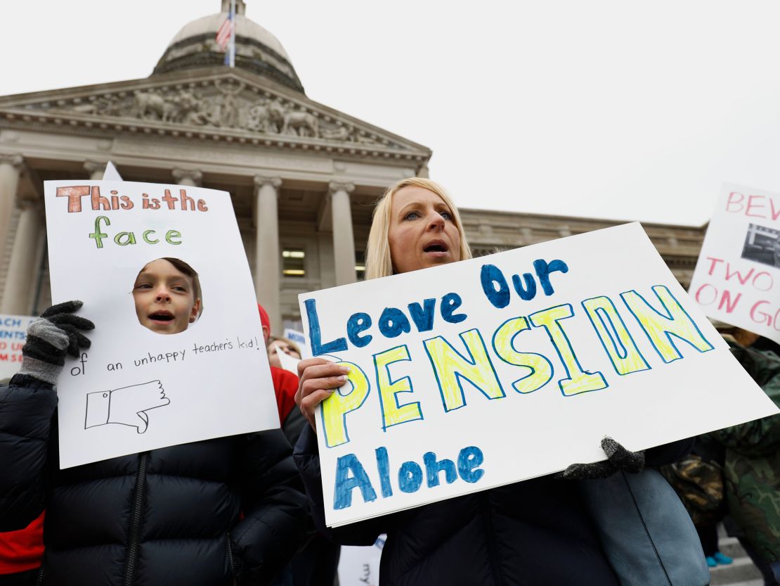 Teachers and their supporters protest against  pension legislation earlier this month in Frankfort.