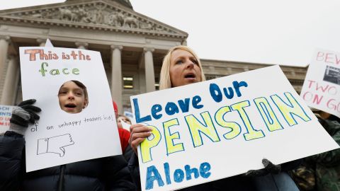 Teachers and their supporters protest against pension legislation earlier this month in Frankfort.