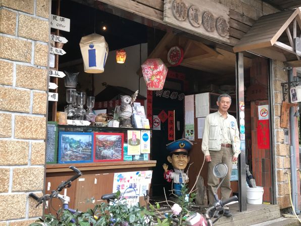 <strong>Passionate about Pingxi:</strong> Wang Chaw-Jing, a local guide and former chairman of the Pingxi Commercial Association, stands in front of his own cafe in Pingxi.