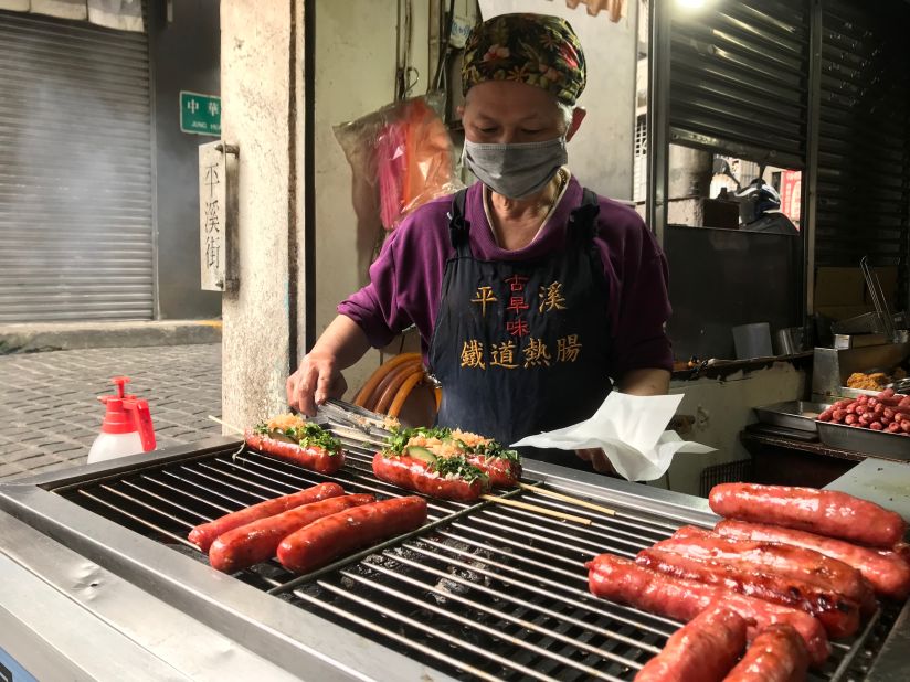 <strong>Railway Sausage: </strong>You Su Zheng grills snacks at her restaurant, Railway Sausage.