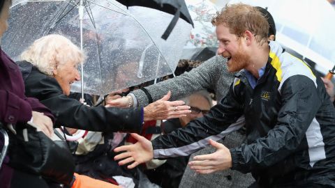 Harry first met an Australian woman named Daphne Dunne on a trip to Sydney in 2015. Back in the city last June, Harry spotted the 97-year-old in the crowd, Jackson explains. "It was the rainiest day, torrential," he recalls. "He rushed over to her in the rain, arms outstretched, and hugged her. It was such a sweet moment... She'd been waiting all day for him."