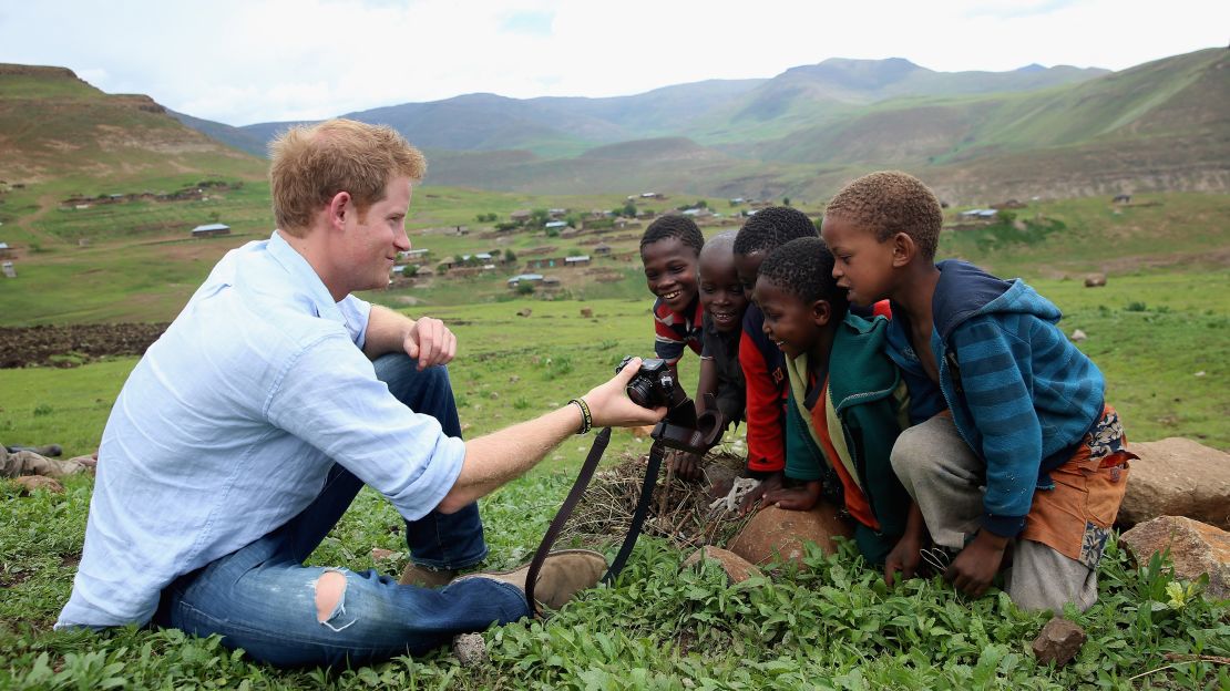In one of Jackson's favorite pictures he has taken of the prince, Harry shows children in Lesotho a photo he has taken on his own camera. This was during a trip in December 2014.