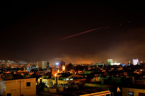Damascus skies erupt with anti-aircraft fire as the US and its allies launch an attack on Syria's capital early on April 14, 2018. US President Donald Trump announced airstrikes in retaliation for Syria's alleged use of chemical weapons. Trump says the strikes are part of a sustained military response, in coordination with France and the United Kingdom.
