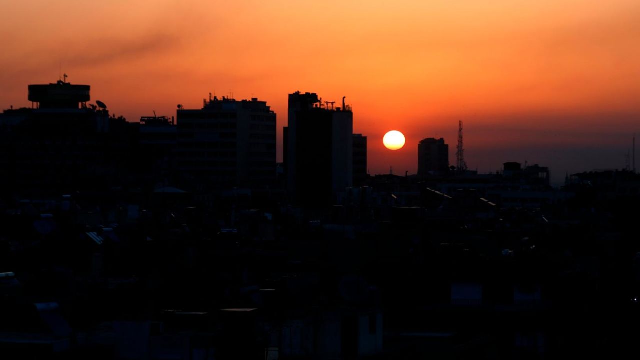 Smoke rises at sunrise after airstrikes targeting different parts of the Syrian capital Damascus, early Saturday, April 14, 2018.