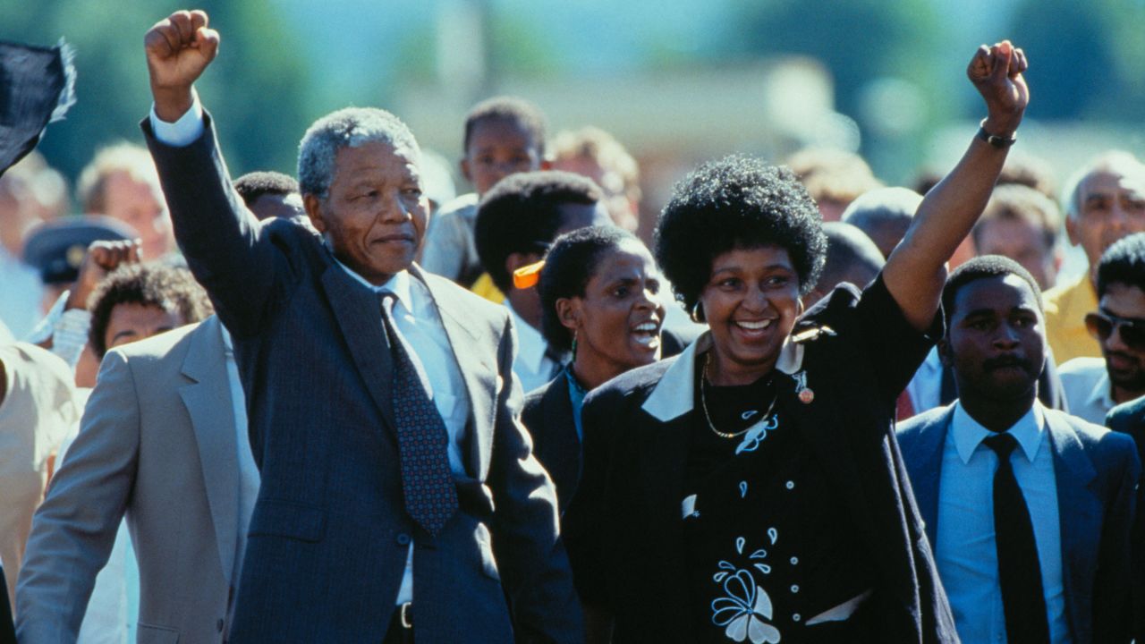 Nelson Mandela, with his then-wife, Winnie Mandela, leaves prison in 1990.