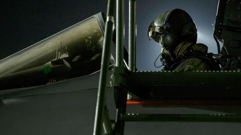 In this image released by Britain's Ministry of Defense, a Tornado pilot sits in his cockpit before flying at Britain Royal Air Force base in Akrotiri, Cyprus Saturday, April 14, 2018. 
