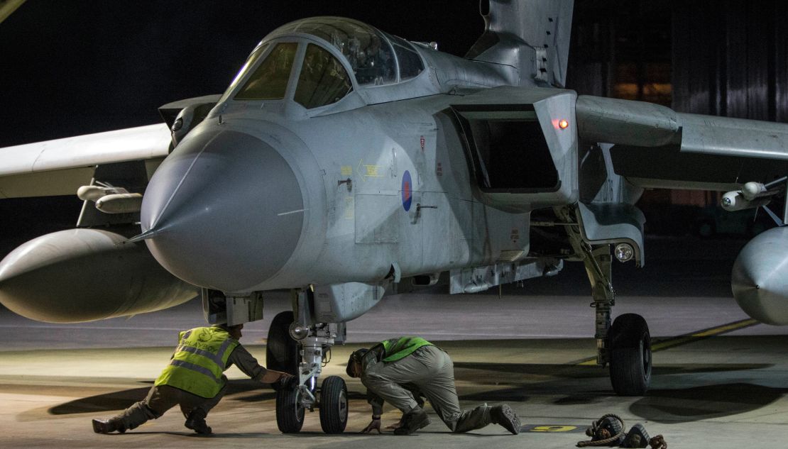 An RAF Tornado taxis into its hangar after landing at the British air force base in Akrotiri, Cyprus, after a Syria strike mission, April 14, 2018.