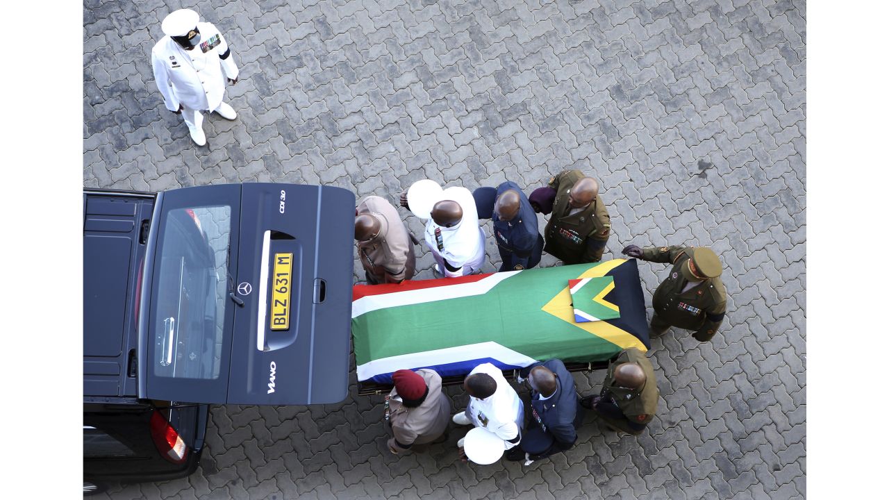 The flag-draped casket carrying Winnie Madikizela-Mandela's remains arrives Saturday, April 14, 2018, at Orlando Stadium in Johannesburg, South Africa.