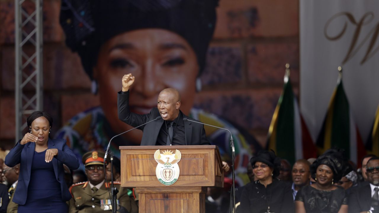Winnie Madikizela-Mandela's image serves as a backdrop at her funeral Saturday at Orlando Stadium in Soweto, as Julius Malema, leader of the Economic Freedom Fighters populist opposition party, pays tribute to her. 