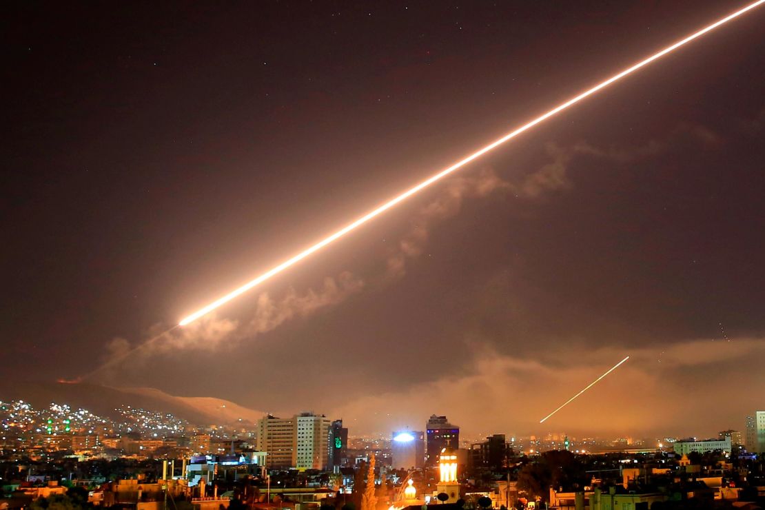 Damascus skies erupt with surface-to-air missile fire as the US, UK and France launch an attack Saturday.
