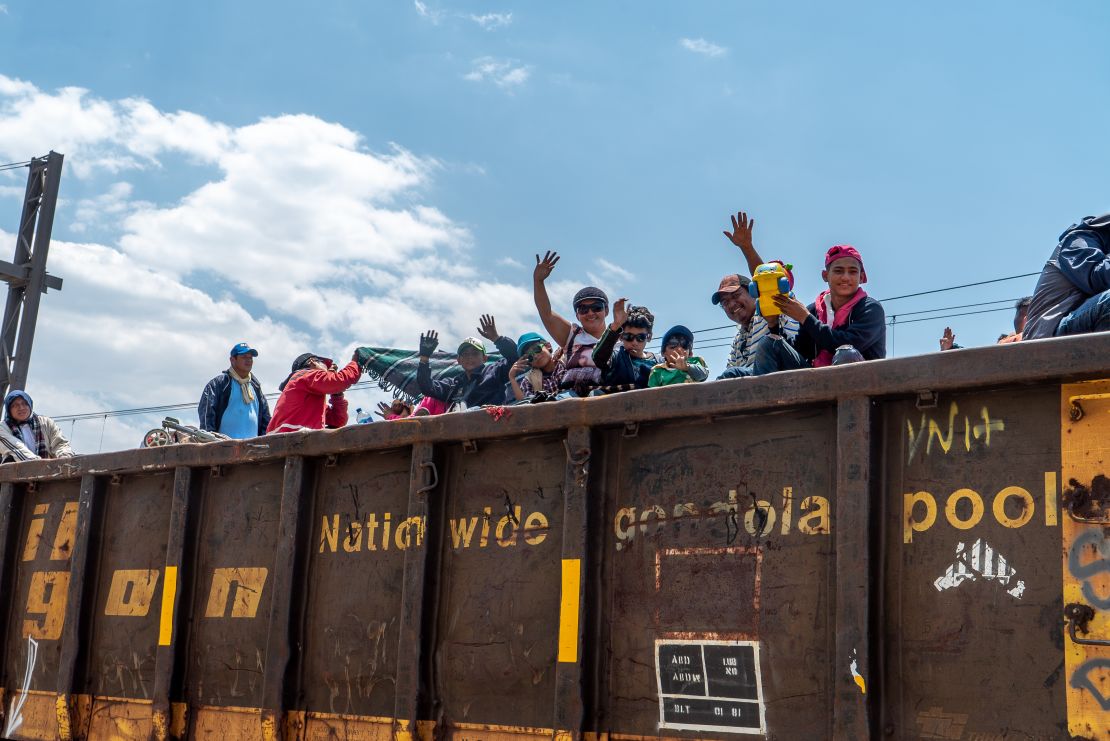 Migrants climbed onto the freight train Saturday in the city of Tultitlán, 1,500 miles south of the US-Mexico border. 