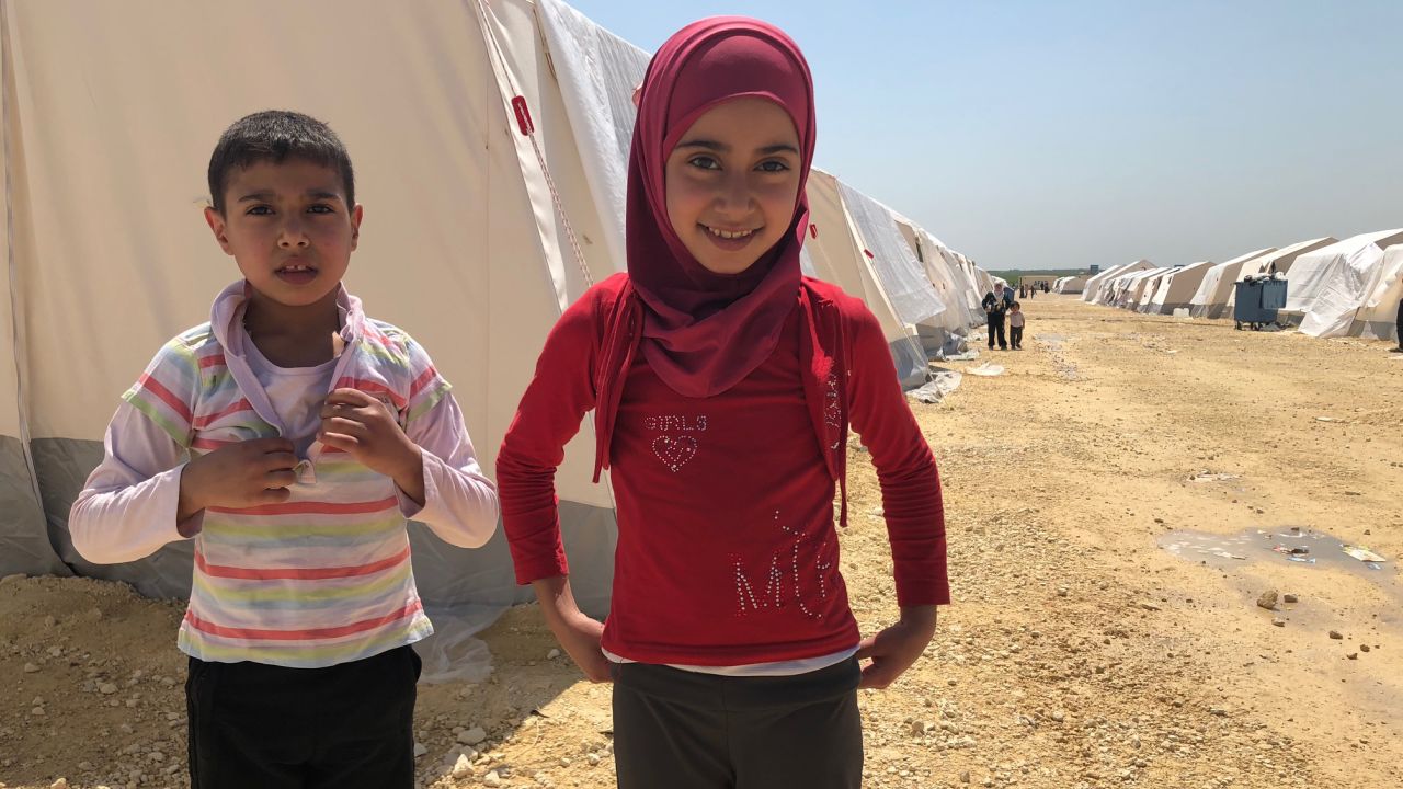 Ten-year-old girl Amira doesn't remember a time when her native neighborhood of Eastern Ghouta wasn't embroiled in war. Pictured at the al-Bol refugee camp in northern Syria with another evacuee, she says she wants to be a teacher when she grows up.