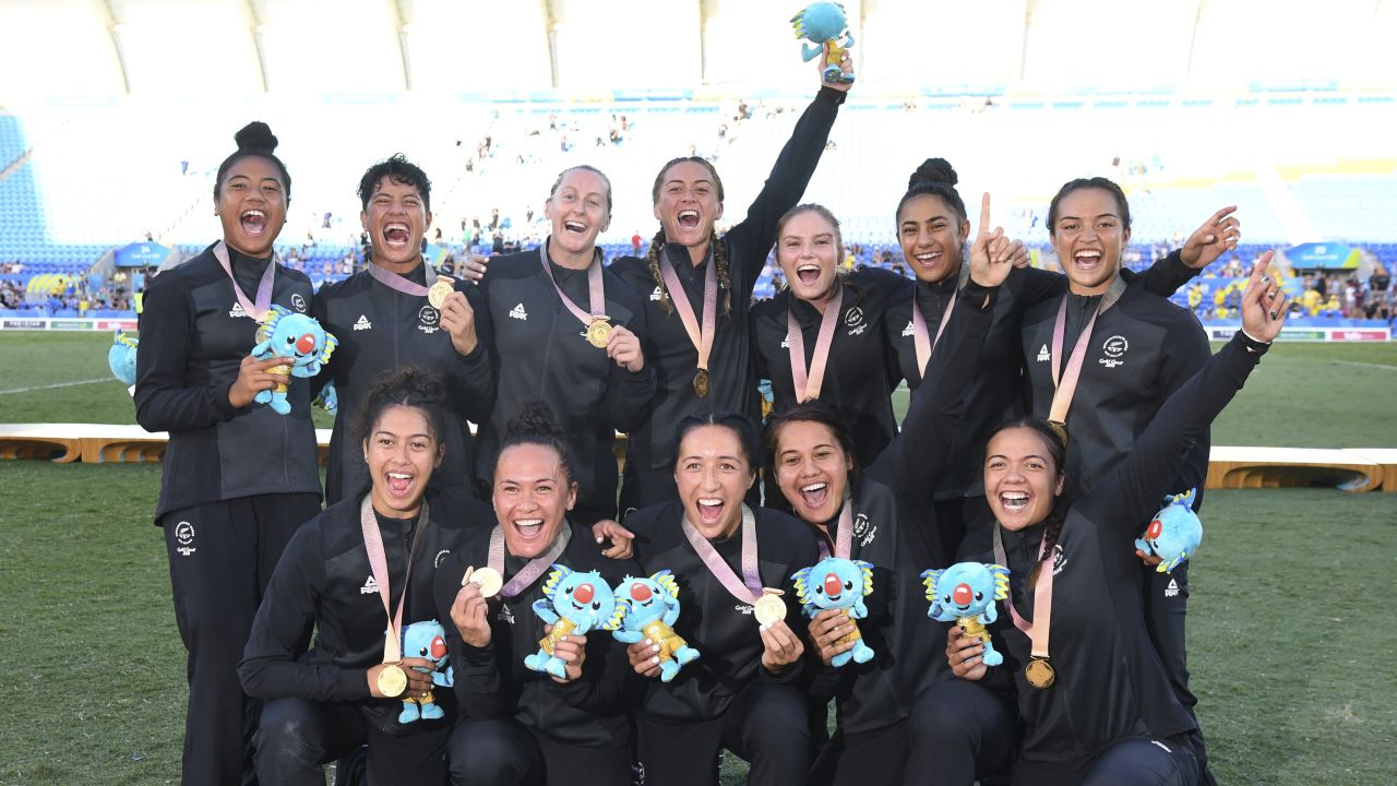 New Zealand celebrates after winning the gold medal in the women's rugby sevens at the Robina Stadium.