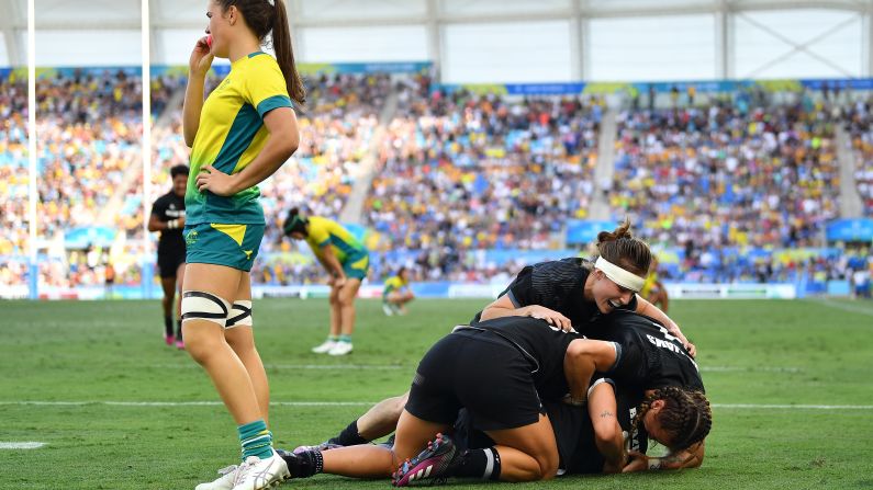 The New Zealand team join in the celebrations by piling on top of Brazier at the end of the game. 