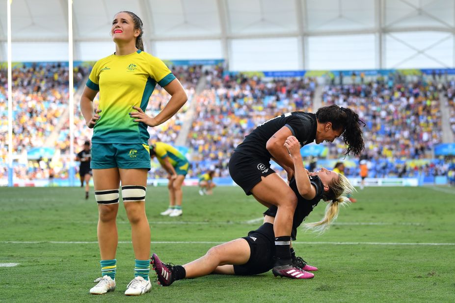 Brazier is congratulated by teammate Portia Woodman after her try secured gold for the Kiwis.