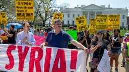 WASHINGTON, DC - APRIL 14: Protesters gather outside the White House and speak out against the latest developments of the strike in Syria on April 14, 2018 in Washington, DC. Yesterday the United States and European allies Britain and France launched airstrikes in Syria as punishment for Syrian President Bashar al-Assad's suspected role in last week's chemical weapons attacks that killed upwards of 40 people. (Photo by Tasos Katopodis/Getty Images)