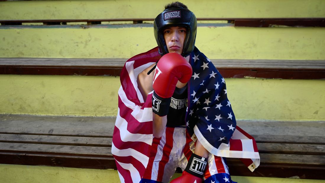 A boxer from Philadelphia, Pennsylvania, watches matches between US and Cuban fighters in Pinar del Rio, Cuba. After the revolution, Cuba was virtually cut off from the US for decades. Now, despite the countries' ongoing political differences, there are a flurry of cultural exchanges taking place.