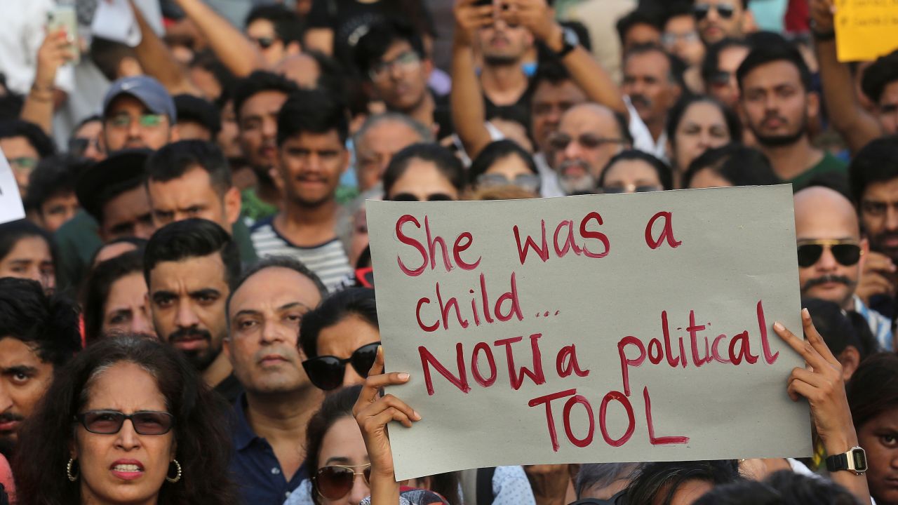 A participant holds a placard during a protest against recent incidents of rape in the country, in Mumbai, India, Sunday, April 15, 2018. 