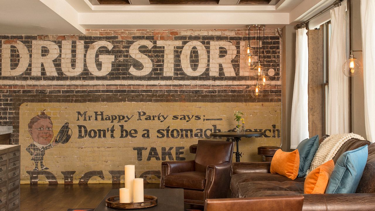<strong>The Drugstore Room:</strong> Each suite is different, and local design elements are found throughout. The Drugstore Room gets its name from this old tile sign.