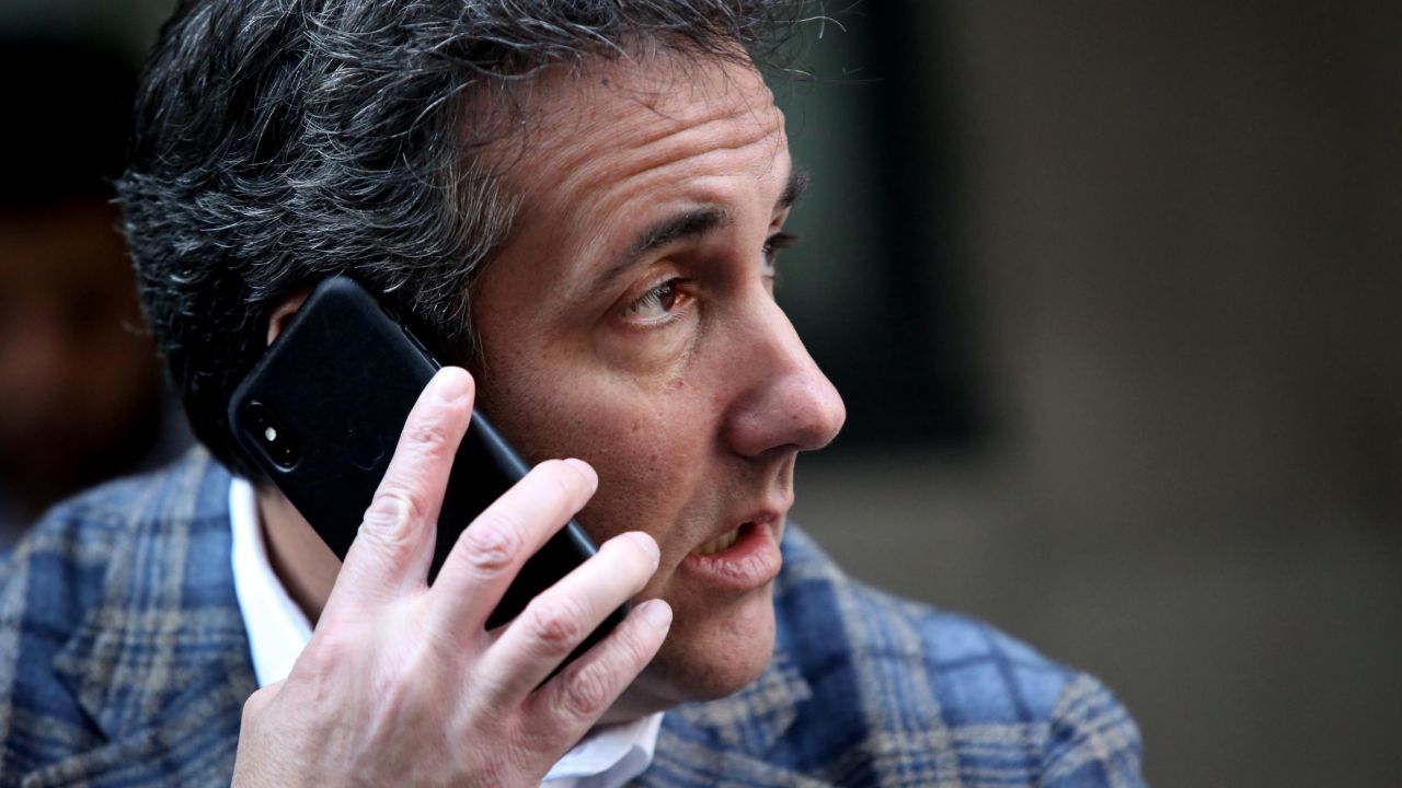 Michael Cohen takes a phone call as he sits outside near the Loews Regency hotel on Park Ave on April 13, 2018 in New York City.