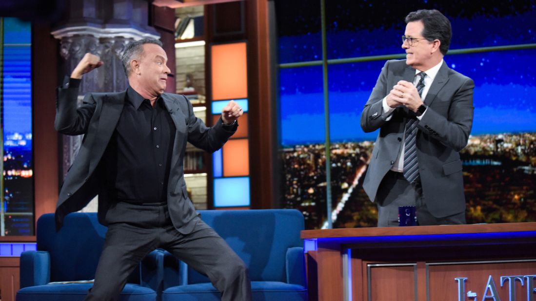 Hanks hams it up with late-night talk show host Stephen Colbert in October 2016.