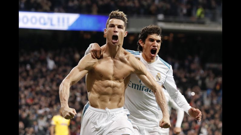 Real Madrid's Cristiano Ronaldo and Jesus Vallejo celebrate during the UEFA Champions League quarter final match against Juventus F.C. on Wednesday, April 11, in Madrid.