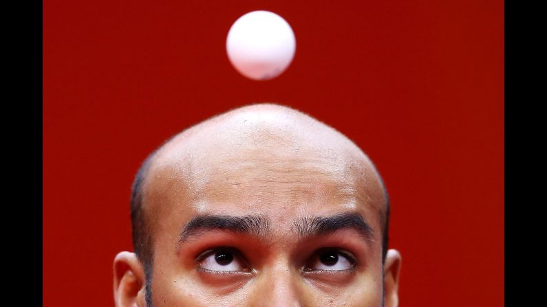 Rhikesh Taucoory of Mauritius eyes the ball as he serves during his men's singles table tennis match against Craig Howieson of Scotland on day six of the Commonwealth Games on the Gold Coast in Australia on Tuesday, April 10.