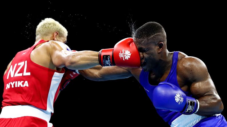 David Nyika of New Zealand, left and Cheavon Clarke of England compete in their men's heavy 91 kilogram semifinal bout on day nine of the Commonwealth Games on the Gold Coast in Australia on Friday, April 13.