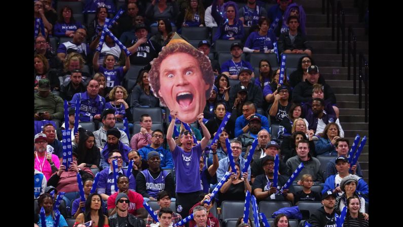 A Sacramento Kings fan holds up a cardboard cutout of Will Ferrell's character from the movie "Elf" during a Houston Rockets free throw on Wednesday, April 11, in Sacramento, California.