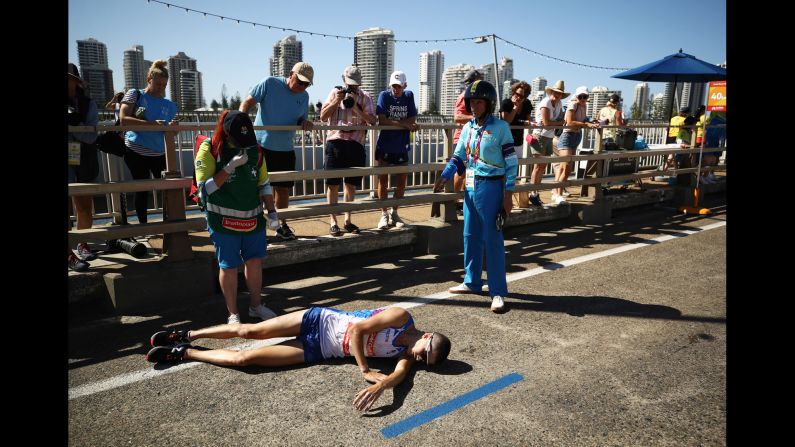 Callum Hawkins of Scotland collapses during the men's marathon on day 11 of the Commonwealth Games on the Gold Coast in Australia on Sunday, April 15.