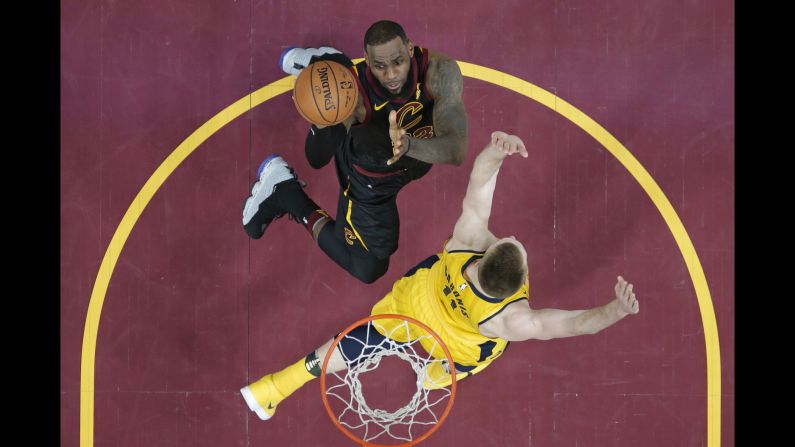 Cleveland Cavaliers' LeBron James drives against Indiana Pacers' Domantas Sabonis in the first half of Game 1 of an NBA basketball first-round playoff series on Sunday, April 15, in Cleveland.