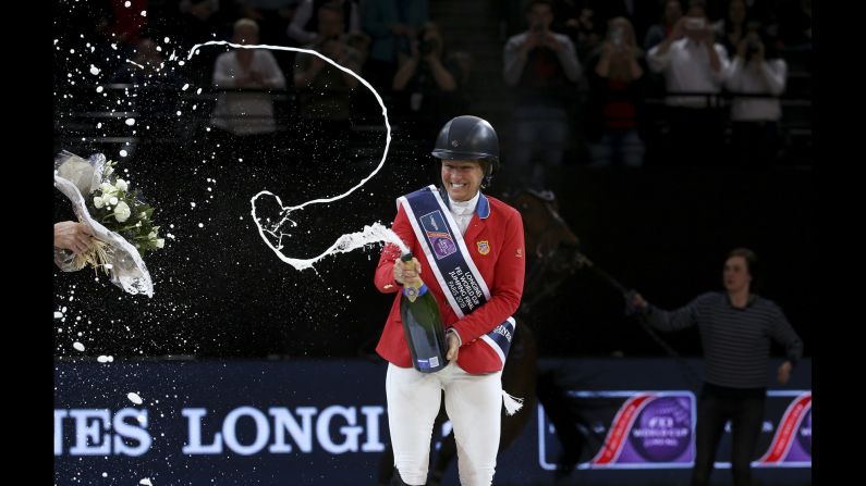 Elizabeth "Beezie" Madden of USA celebrates during the trophy ceremony after winning the FEI World Cup Jumping Final on Saturday, April 14, in Paris.